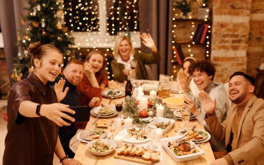 a family celebrating christmas while dining