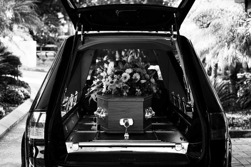 a casket in a funeral vehicle